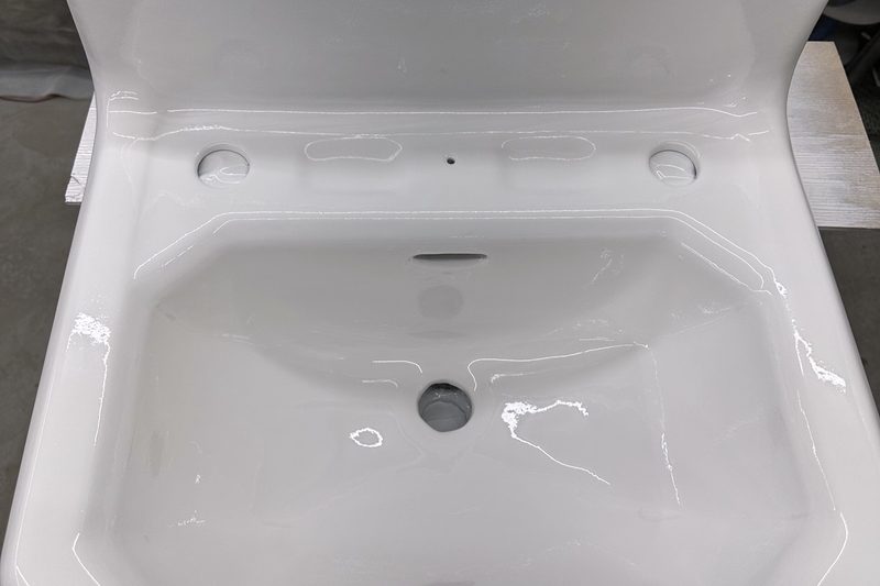 Refinished white bathroom sink with a glossy finish by Blackstone Tub Refinishers Calgary