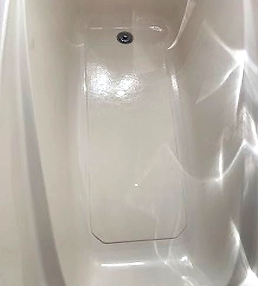 Fiberglass tub floor inlay installed by Blackstone Tub Refinishers Calgary — permanent fix for a cracked tub floor